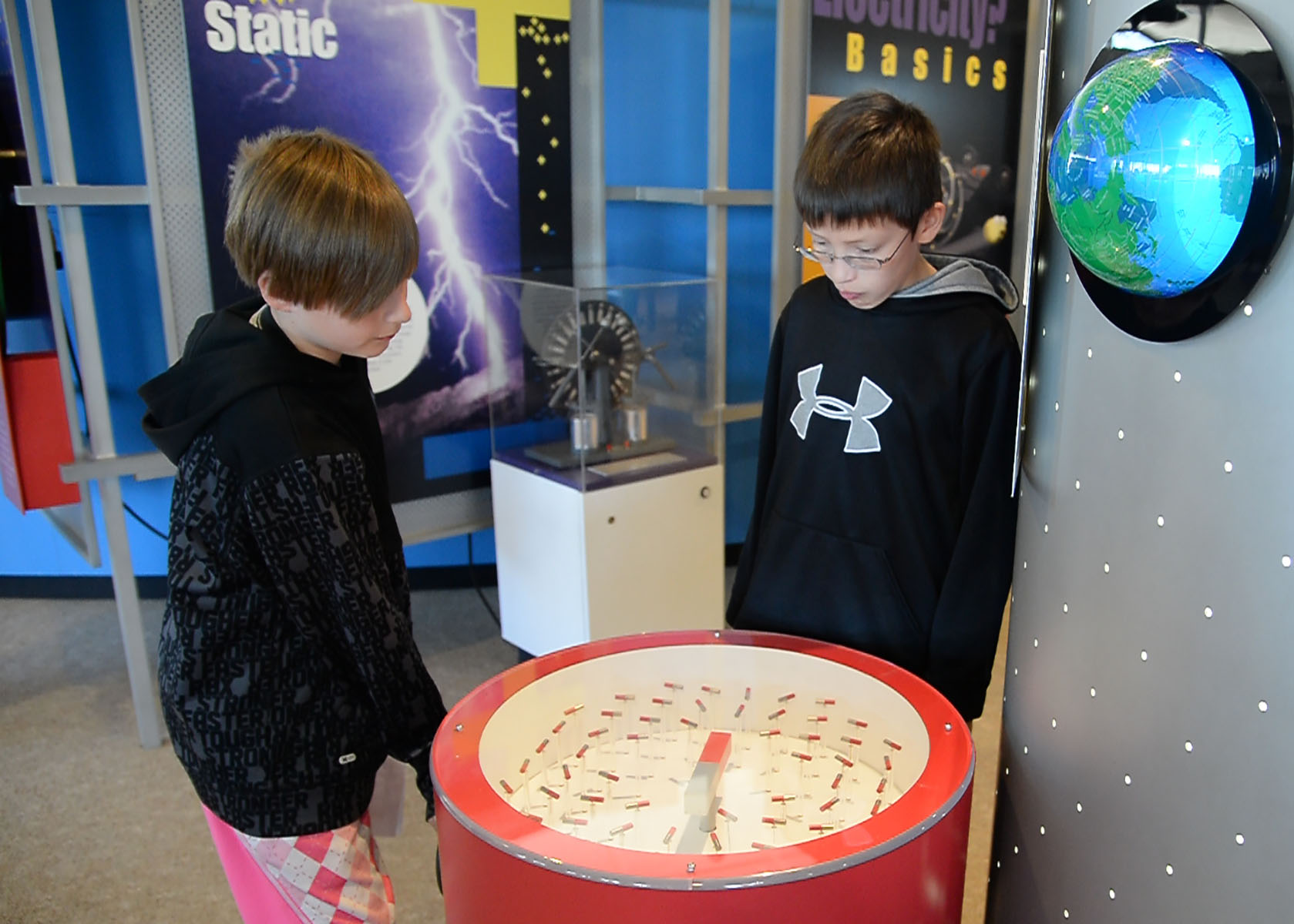 Boys at a magnetic field exhibit