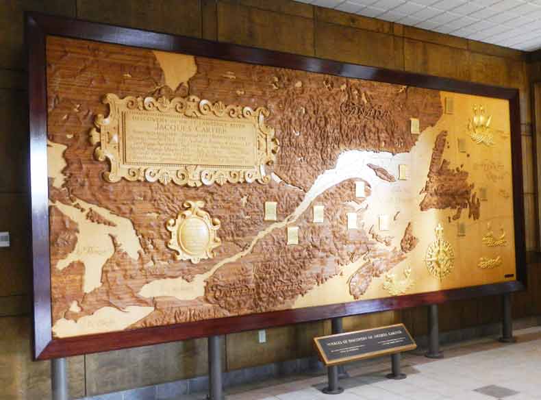 Walnut wood carving portrays the passage through the Gulf of St. Lawrence and the St. Lawrence River in the 16th century by the French Explorer Jacques Cartier